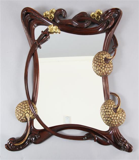 An Art Nouveau style parcel gilt hardwood wall mirror, W.3ft 3in. H.3ft 7in.